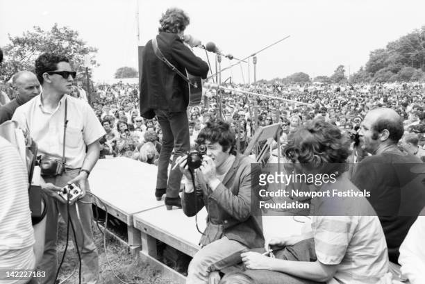 Singer/songwriter Bob Dylan performs at the Newport Folk Festival in July 1965 in Newport, Rhode Island. Singer/songwriter Donovan , making his U.S....