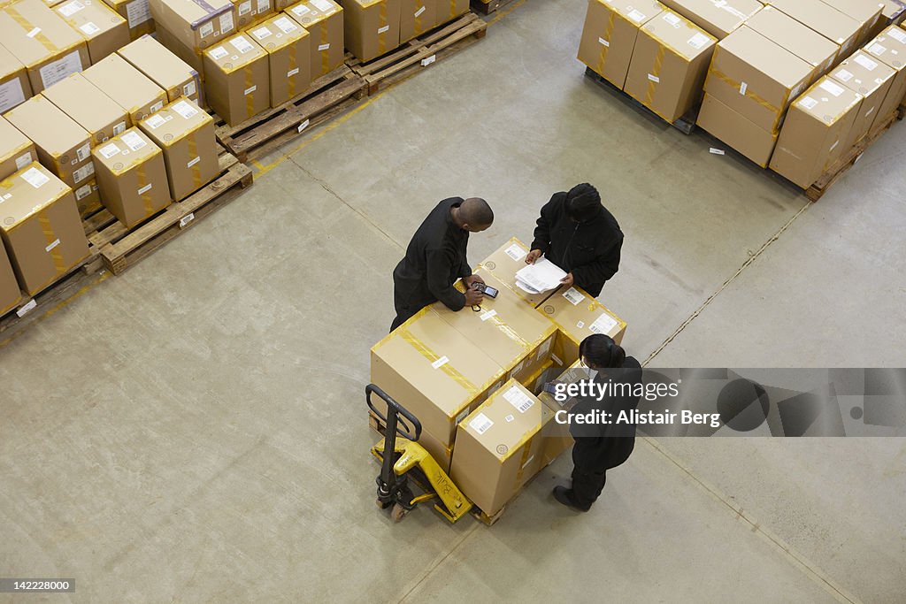 Sorting Box Factory Workers Sorting Boxes In A Warehouse High-Res Stock Photo - Getty Images