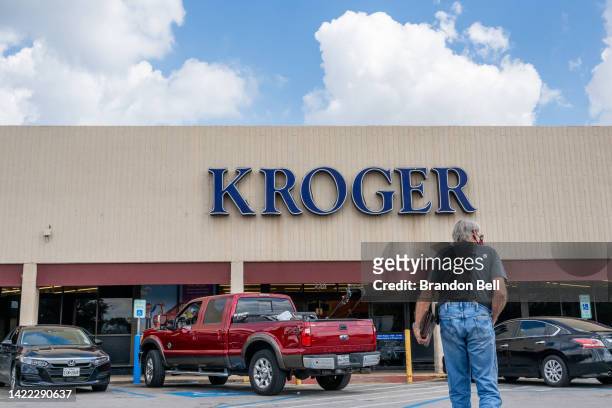 Customer walks into a Kroger grocery store on September 09, 2022 in Houston, Texas. Kroger stock increased six percent as the company surpassed...