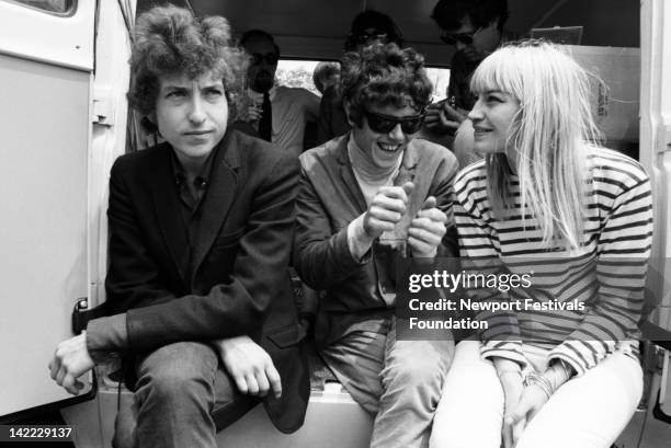 Musicians Bob Dylan, Donovan, and Mary Travers of Peter Paul and Mary backstage at the Newport Folk Festival in July 1965 in Newport, Rhode Island.