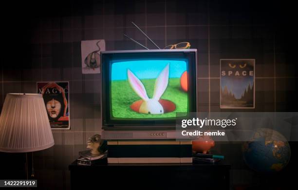 tv with cartoon movie - film screening room stock pictures, royalty-free photos & images