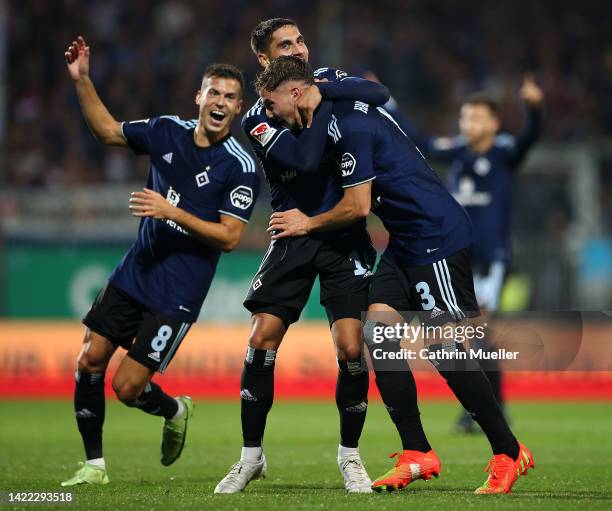 Ludovit Reis of Hamburg SV celebrates scoring his teams third goal of the game with team mates Laszlo Benes and Moritz Heyer during the Second...