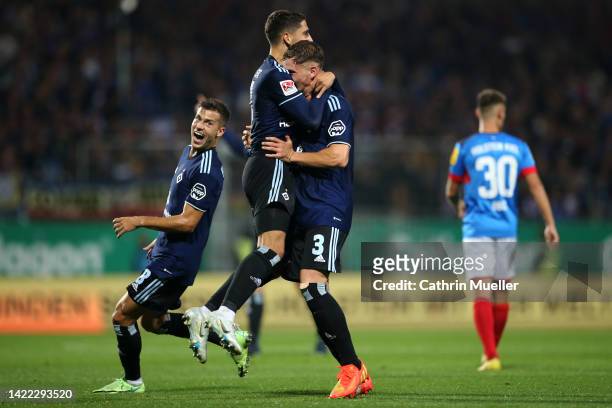 Ludovit Reis of Hamburg SV celebrates scoring his teams third goal of the game with team mates Laszlo Benes and Moritz Heyer during the Second...