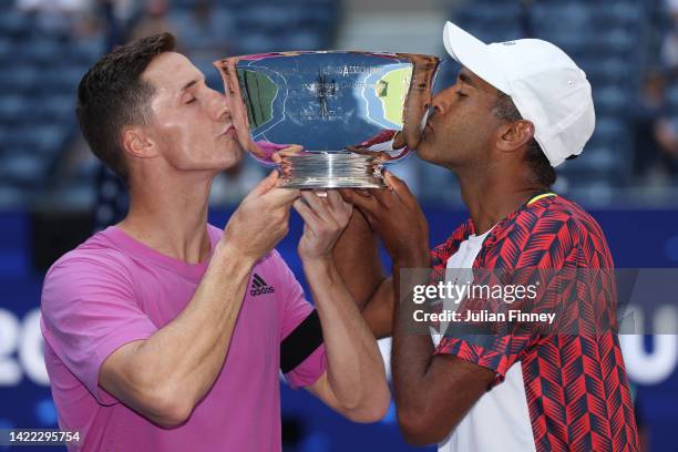 Rajeev Ram of the United States and Joe Salisbury of Great Britain celebrate with the trophy after winning their Men's Doubles Final match against...