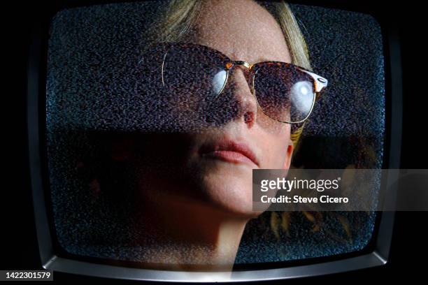 tv screen of woman wearing sunglasses - one woman only videos stock pictures, royalty-free photos & images