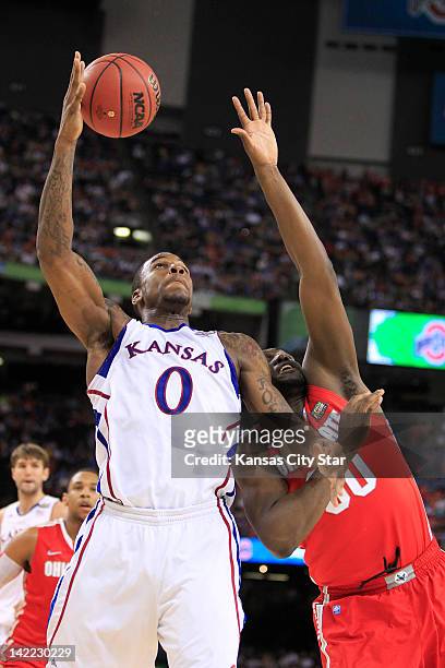 Kansas' Thomas Robinson grabs a rebound from Ohio State's Evan Ravenel in the NCAA Tournament semifinals at the Mercedes-Benz Superdome in New...