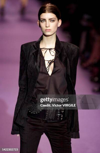 France Luca Gajdus walks the runway during the Yves Saint Laurent Ready to Wear Fall/Winter 2001-2002 fashion show as part of the Paris Fashion Week...