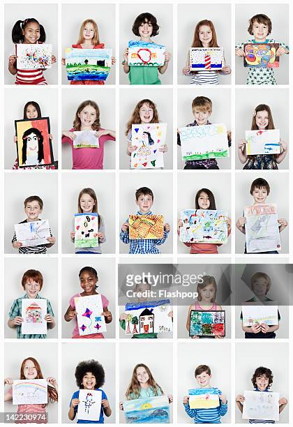 portrait of children holding their art work - kids drawing stock-fotos und bilder