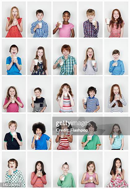 group of children drinking a glass of milk - drinking milk stock pictures, royalty-free photos & images