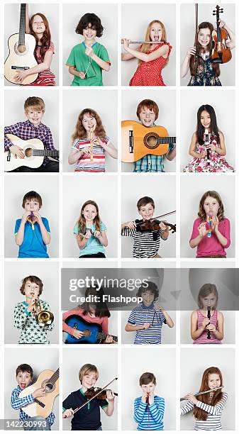 group of children  playing musical instruments - triangle percussion instrument stock pictures, royalty-free photos & images