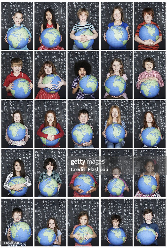 Group of children holding a globe in class