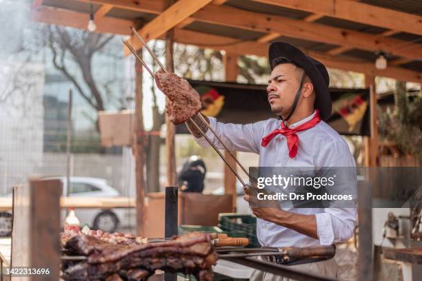 gaucho couple having a barbecue at the farroupilha camp - porto alegre bildbanksfoton och bilder