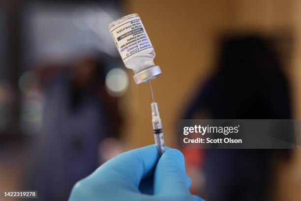 Pharmacist prepares to administer COVID-19 vaccine booster shots during an event hosted by the Chicago Department of Public Health at the Southwest...