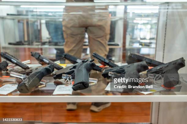 Smith & Wesson handguns are seen for sale in a gun store on September 09, 2022 in Houston, Texas. Smith & Wesson Brands Inc. Reported its lowest...