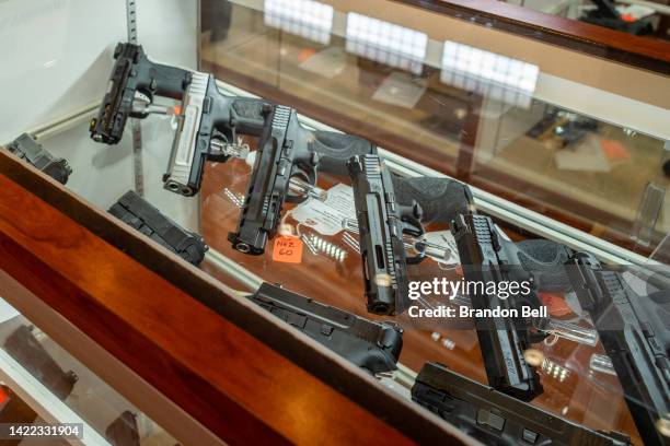 Smith & Wesson handguns are seen for sale in a gun store on September 09, 2022 in Houston, Texas. Smith & Wesson Brands Inc. Reported its lowest...