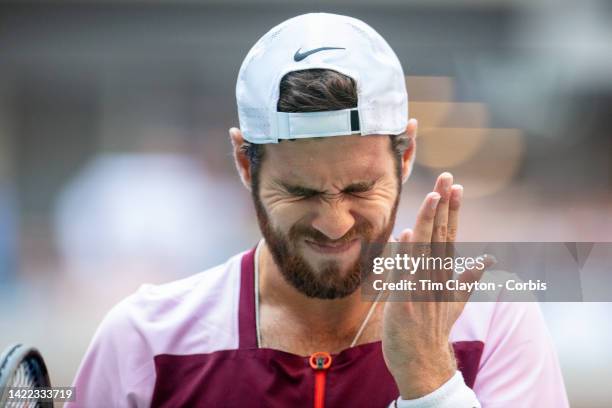 September 09: Karen Khachanov of Russia slaps himself in the face after missing a point during his loss against Casper Ruud of Norway in the Men's...