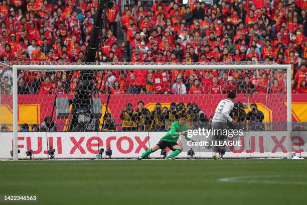 Daiki Iwamasa of Kashima Antlers takes a penalty saved by Seigo Narazaki of Nagoya Grampus during the penalty shootout following the Fuji Xerox Super...