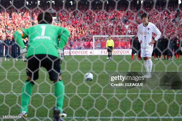 Toru Araiba of Kashima Antlers takes a penalty during the penalty shootout following the Fuji Xerox Super Cup between Nagoya Grampus and Kashima...