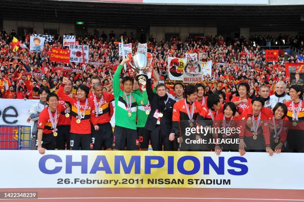 Nagoya Grampus players and staffs celebrate following the Fuji Xerox Super Cup between Nagoya Grampus and Kashima Antlers at Nissan Stadium on...