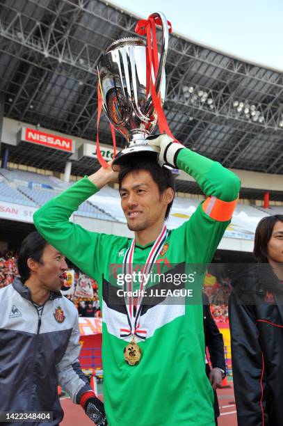 Captain Seigo Narazaki of Nagoya Grampus presents the trophy for supporters following the Fuji Xerox Super Cup between Nagoya Grampus and Kashima...