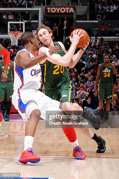 Gordon Hayward of the Utah Jazz dribbles against Chris Paul of the Los Angeles Clippers at Staples Center on March 31, 2012 in Los Angeles,...