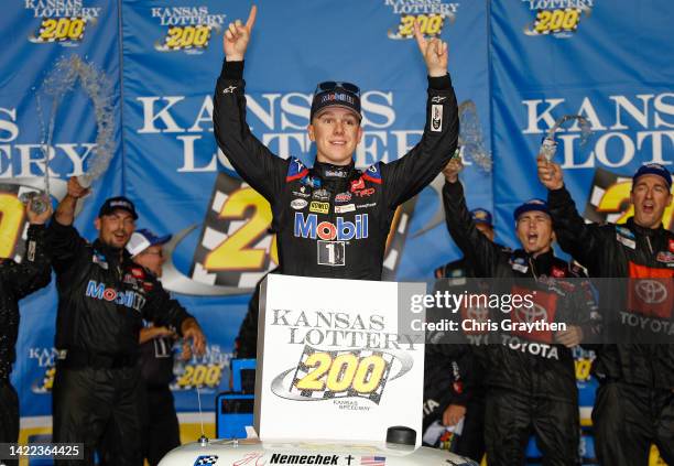 John Hunter Nemechek, driver of the Mobil 1 Toyota, celebrates in victory lane after winning the NASCAR Camping World Truck Series Kansas Lottery 200...