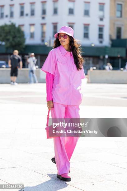 Babba Rivera is seen wearing pink bucket hat, button shirt, pants, bag outside Bronx & Banco on September 09, 2022 in New York City.