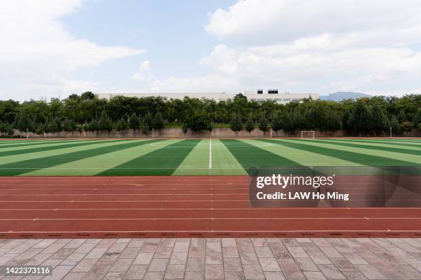school athletic field - empty school yard stock pictures, royalty-free photos & images
