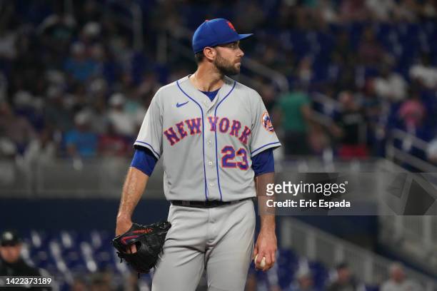 David Peterson of the New York Mets looks off into the distance before being pulled for a relief pitcher in the fourth inning against the Miami...