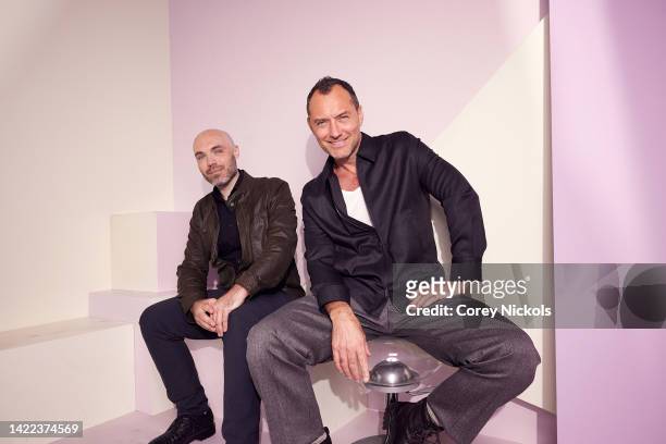 David Lowery and Jude Law pose at the IMDb Official Portrait Studio during D23 2022 at Anaheim Convention Center on September 09, 2022 in Anaheim,...