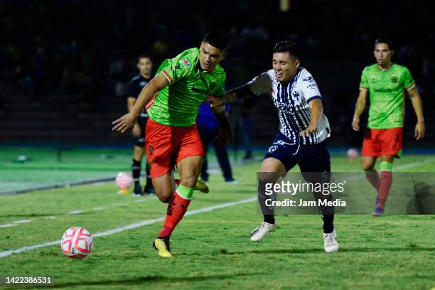 Gabriel Fernández of Juarez fights for the ball with Claudio Kranevitter of Monterrey during the 14th round match between FC Juarez and Monterrey as...