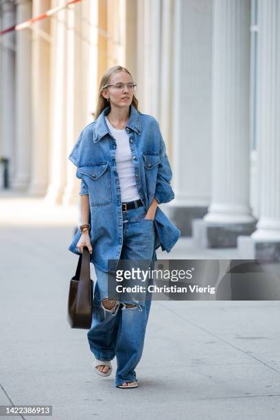 Alexandra Carl wearing Khaite bag, denim jeans, shirt outside Proenza Schouler on September 09, 2022 in New York City.