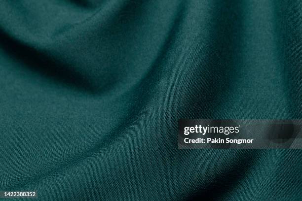 green color fabric cloth polyester texture and textile background. - textiel stockfoto's en -beelden