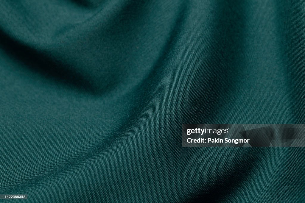 Green color fabric cloth polyester texture and textile background.