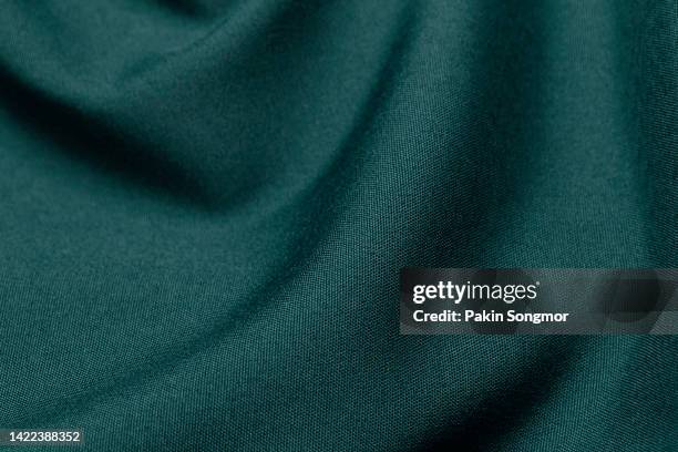 green color fabric cloth polyester texture and textile background. - vävnad bildbanksfoton och bilder
