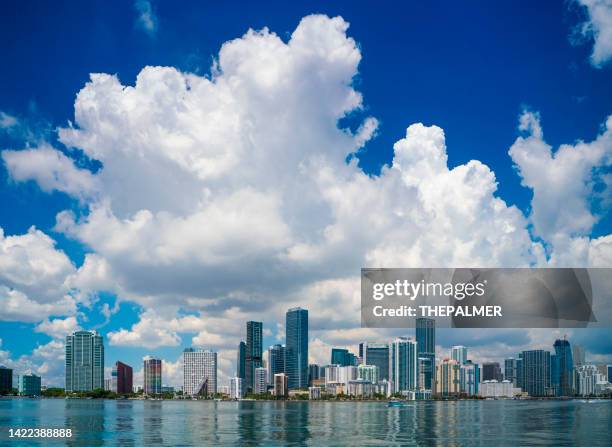 puffy clouds behind on brickell key skyline, miami florida - key biscayne bildbanksfoton och bilder