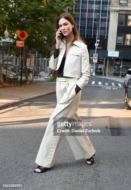 Karlie Kloss is seen wearing a cream Proenza Schouler jacket and pants outside the Proenza Schouler show during New York Fashion Week S/S 2023 on...