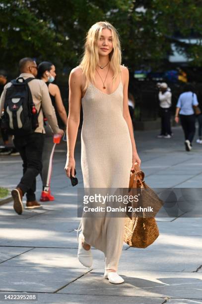 Jessie Andrews is seen wearing a cream dress and brown bag outside the Proenza Schouler show during New York Fashion Week S/S 2023 on September 09,...