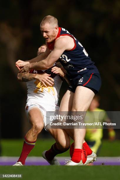 Mitchell White of Casey bumps Mitch Robinson of Brisbane during the VFL Preliminary Final match between Casey Demons and Brisbane Lions at Casey...