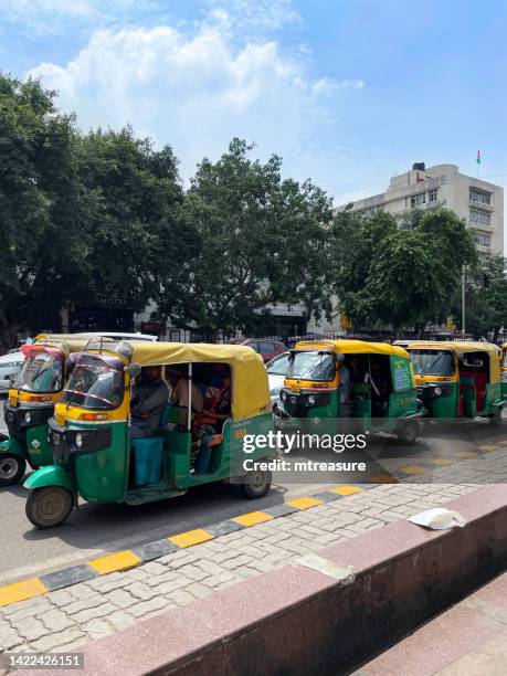 Image of Indian auto rickshaw taxi cabs stuck in traffic, yellow and ...