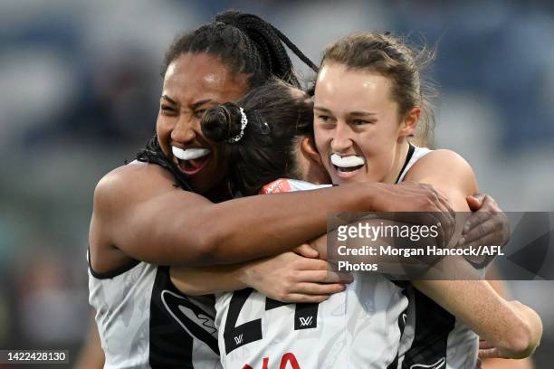 Magpies players celebrate after Jordyn Allen of the Magpies kicked a goal during the round three AFLW match between the Geelong Cats and the...
