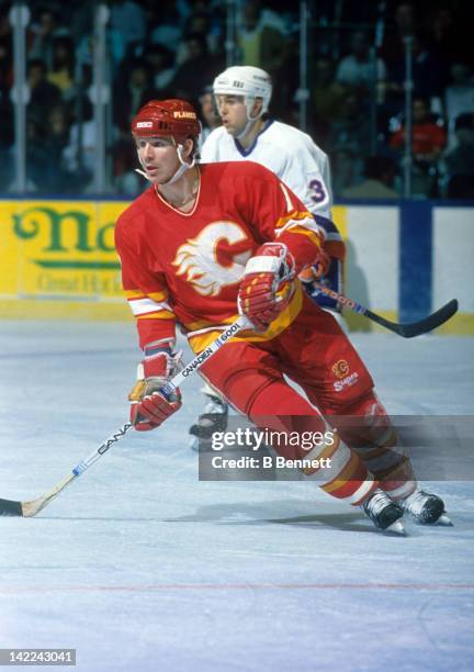 Joe Mullen of the Calgary Flames skates on the ice during an NHL game against the New York Islanders on March 27, 1990 at the Nassau Coliseum in...