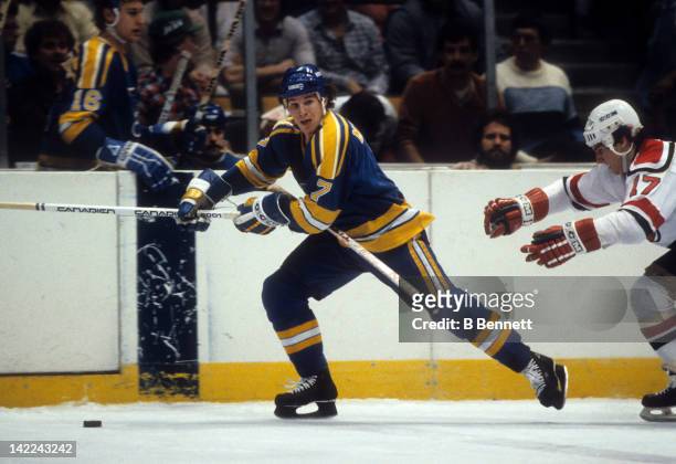 Joe Mullen of the St. Louis Blues skates with the puck during an NHL game against the New Jersey Devils on January 20, 1983 at the Brendan Byrne...