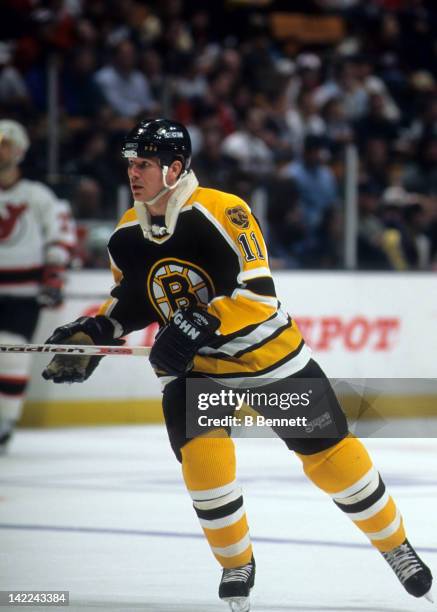 Joe Mullen of the Boston Bruins skates on the ice during an NHL game against the New Jersey Devils on March 20, 1996 at the Brendan Byrne Arena in...