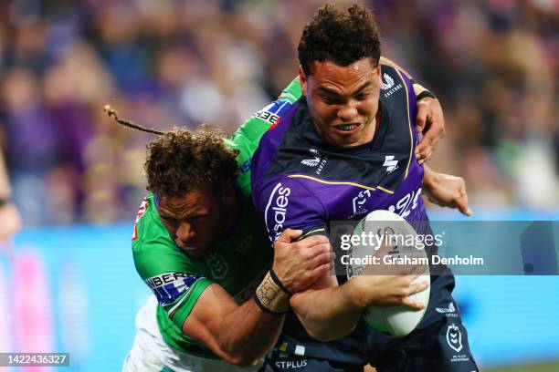 Xavier Coates of the Storm is tackled during the NRL Elimination Final match between the Melbourne Storm and the Canberra Raiders at AAMI Park on...