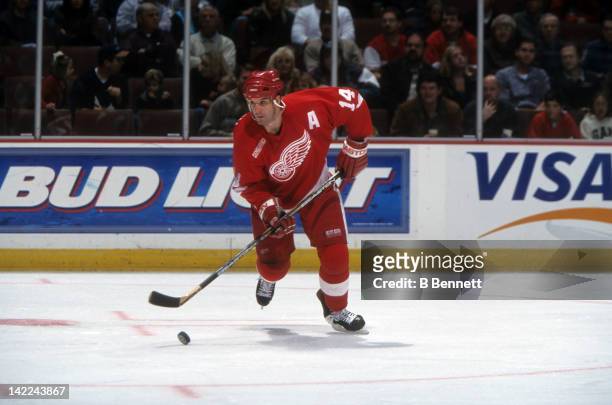 Brendan Shanahan of the Detroit Red Wings skates with the puck during an NHL game circa 2000.