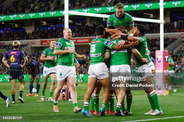 Elliott Whitehead of the Raiders celebrates with team mates after scoring a try during the NRL Elimination Final match between the Melbourne Storm...