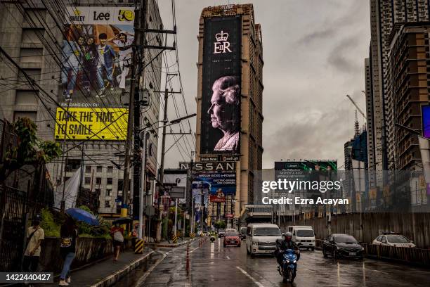 An electronic billboard shows a tribute to Queen Elizabeth II on September 10, 2022 in Mandaluyong, Metro Manila, Philippines. Queen Elizabeth II...