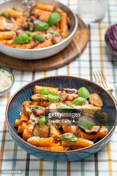 pasta with aubergines tomato sauce - rigatoni stock-fotos und bilder