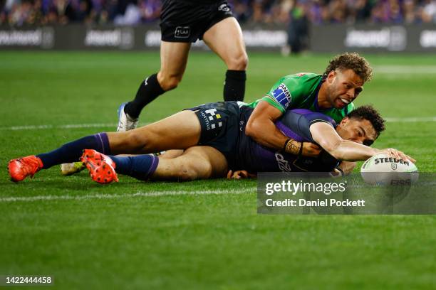 Xavier Coates of the Storm breaks a tackle to score a try during the NRL Elimination Final match between the Melbourne Storm and the Canberra Raiders...